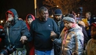 Eric Garner's stepfather comforts grieving man after grand jury decision