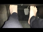 Pedal pumping driving barefoot in yoga pants