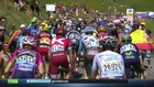 Chris Froome punches a running fan in his face during the race