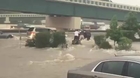 Bystanders rescue driver from rising water