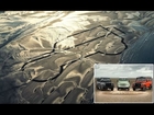 Six Land Rover Defenders create Britain's biggest ever sand drawing on Anglesey beach