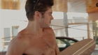Shirtless Zac Efron builds skateboard for charity