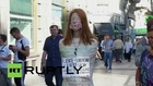 Spain: Activist covers herself in duct tape to protest 'gag law'